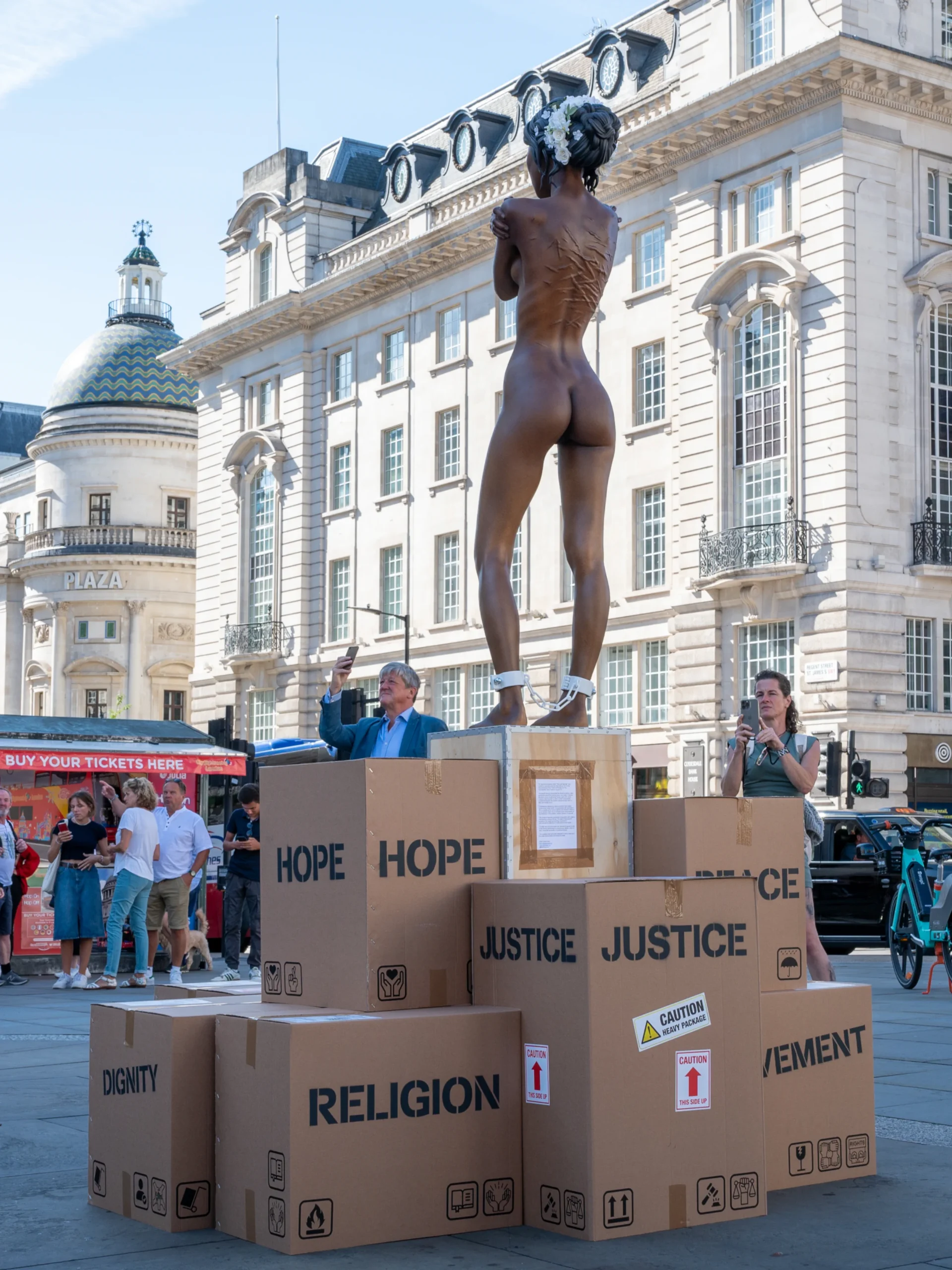 Daniel-Paul_You-Can-Buy-Me_Figurative-Sculpture_London_2023_Rear-View blank
