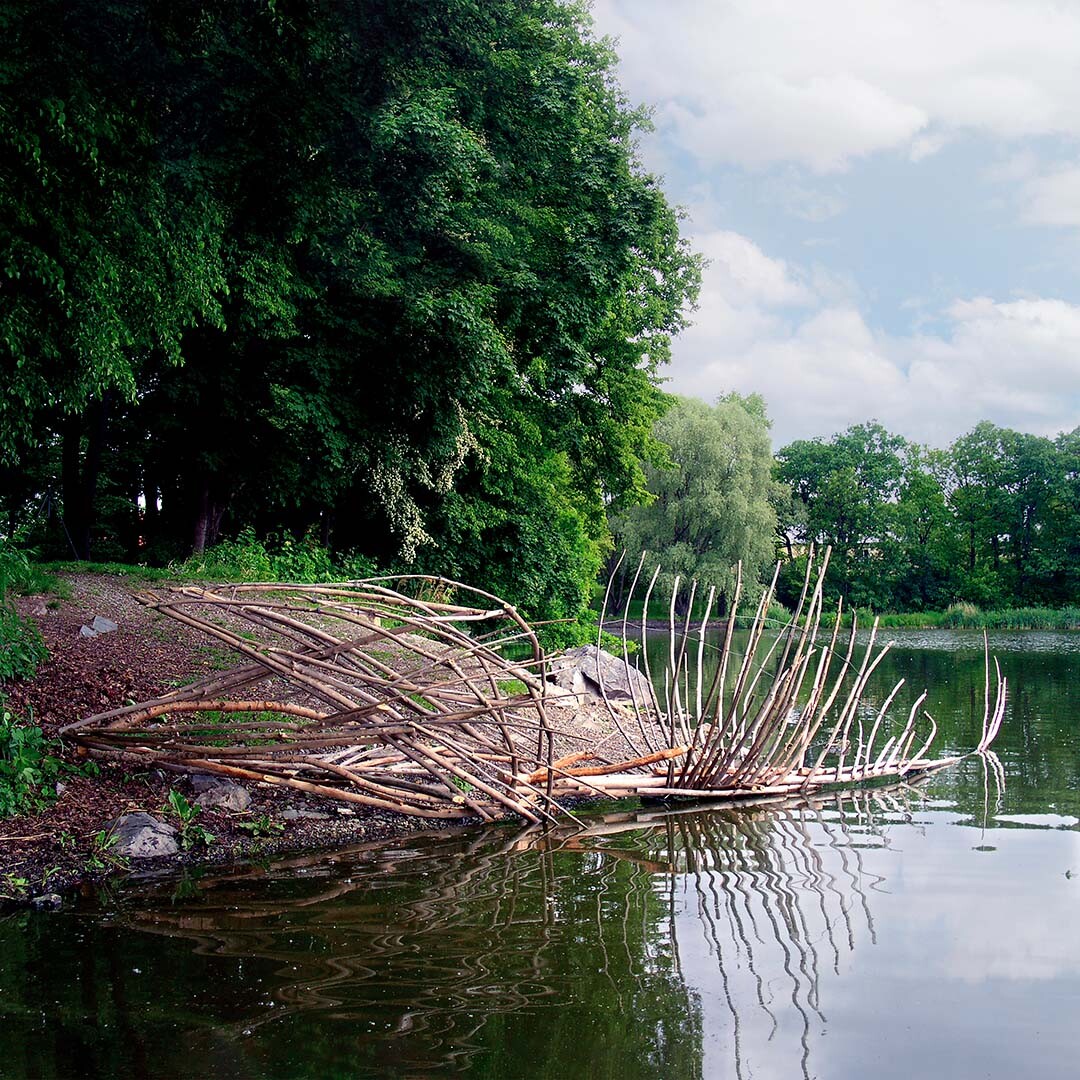Fish on the Shore, 2004 Fish on Shore, 2004 — site-specific installation by Daniel Paul of a fish skeleton-like structure made from branches at the edge of a pond