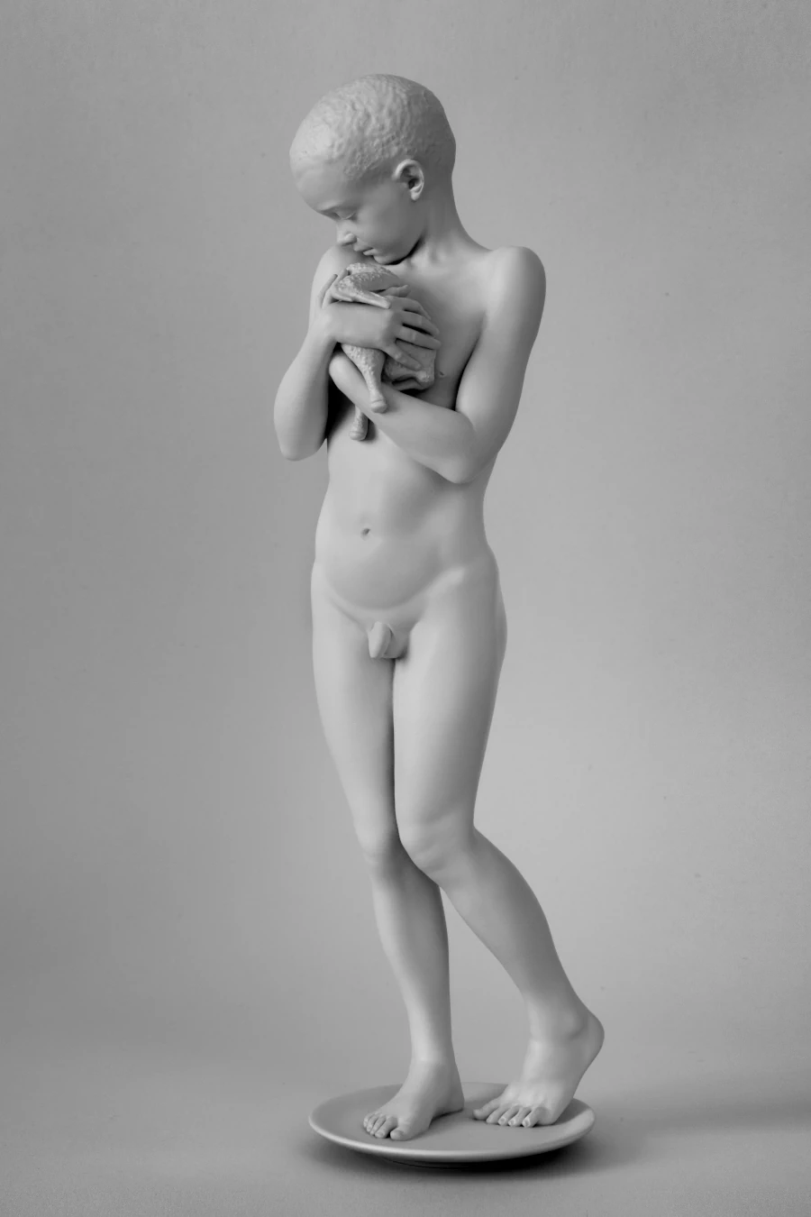 Dream, 2024 Dream, 2024. Monochrome sculpture of a child holding a featherless bird.