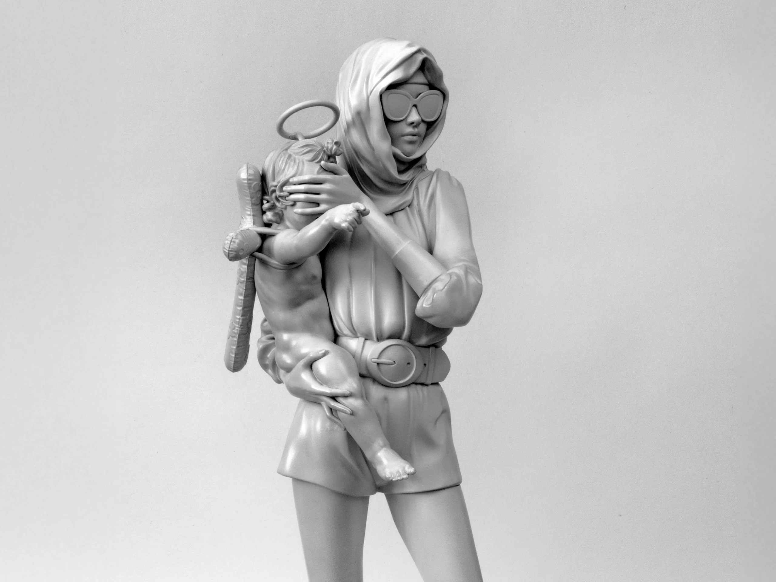 Madonna, 2024 Madonna by Daniel Paul, monochrome sculpture of a woman in sunglasses holding a child